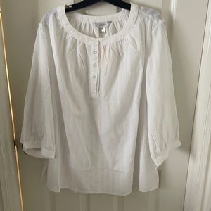 A white 3/4 length sleeve blouse